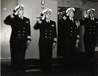  Photo taken somewhere from the Fall of 1953 to Spring of 1954. The Macon was the flagship for Cruiser Division Six. Officers identified as (L-R) RADM Arleigh Burke, Commander Cruiser Division Six, and Capt. U.S.G. Sharp, Jr., Commanding Officer of the Macon. Should any former member of the Macon have the names of the last two gentlemen, please let me know.